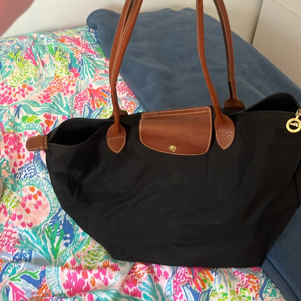 Longchamp black large bag. Enough to fit two days worth of clothes.